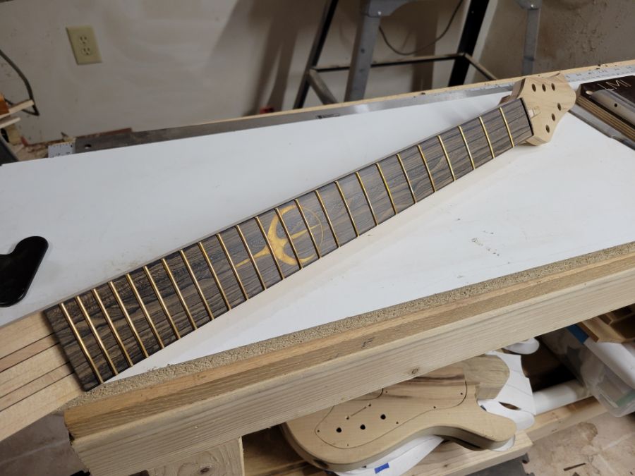 Fretboard with Beveled Frets