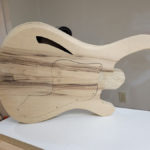 Front of the guitar body sitting on the workbench