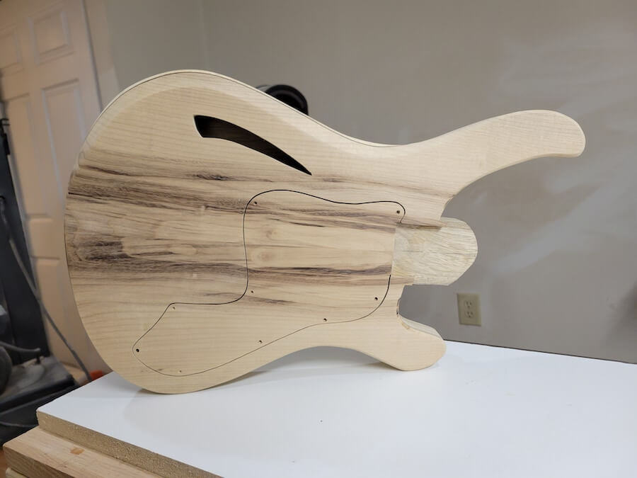 Front of the guitar body sitting on the workbench